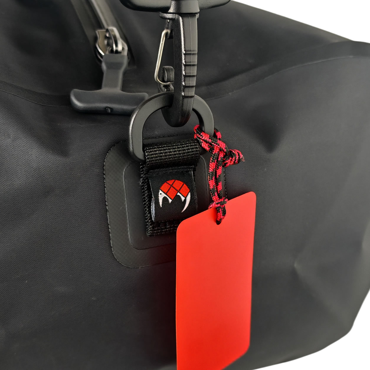 Drop Bag 30L 9 Close-up of the attachment hook and identification tag on the ORGA Drop Bag