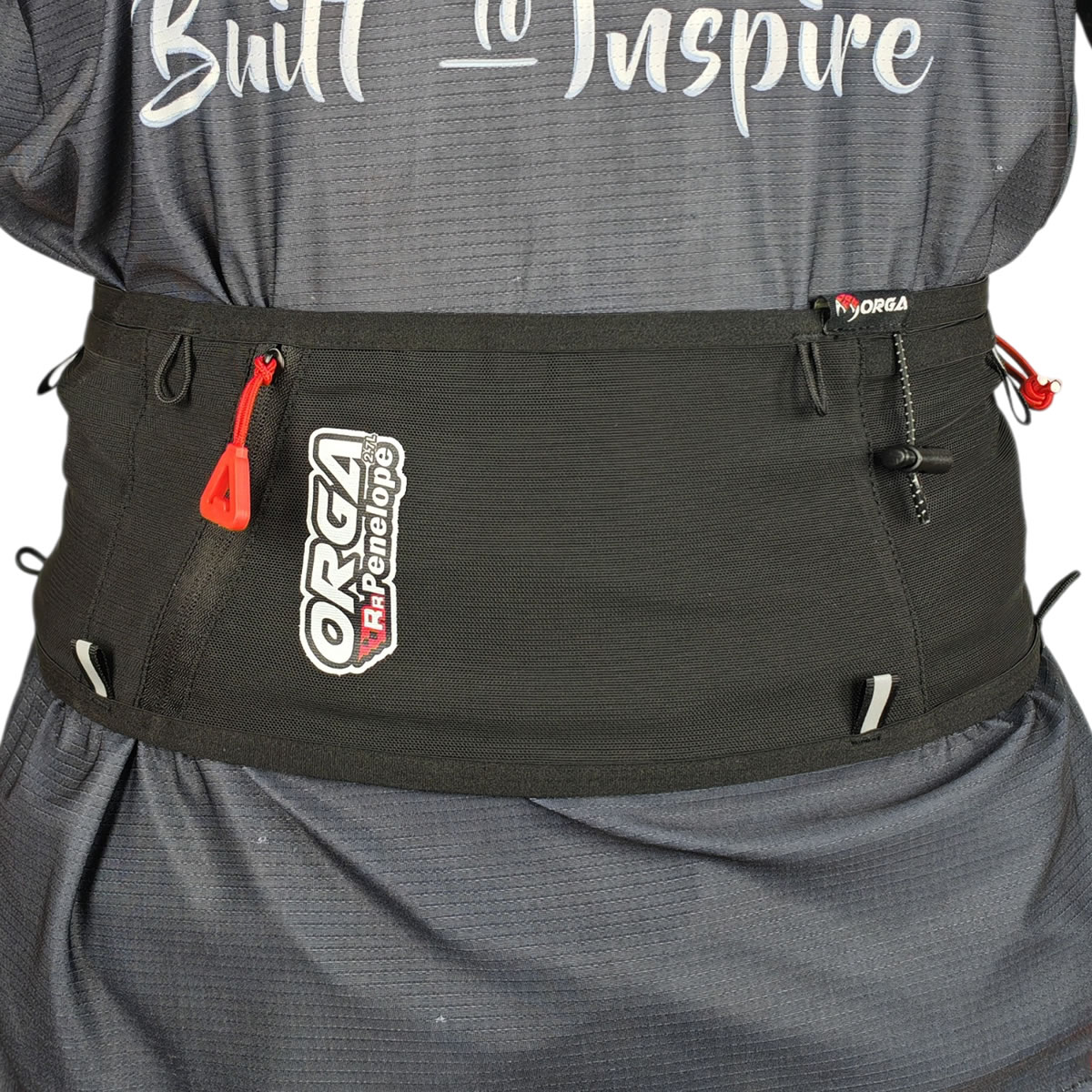 RR Penelope 2.7L 4 Orga RR Penelope running belt worn around the waist, showing its front storage compartments and reflective safety strips.